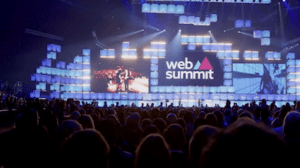 People sat looking at the stage at web summit conference